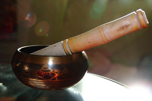 Tibetan singing bowl with a wooden stick