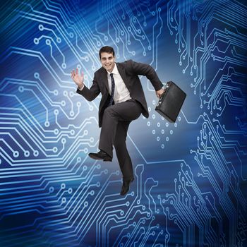 Businessman jumping in the air with a circuit board on the background