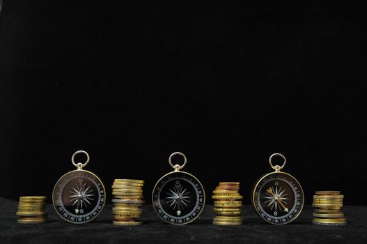 Orientation in  Business Compass and Money on a Black Background