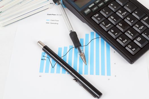 businessman workplace with money, coins, pen and calculator