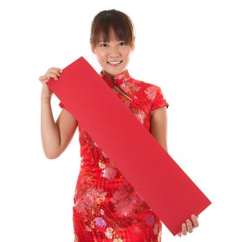 Asian woman with Chinese traditional dress cheongsam or qipao holding couplet, Isolated on white background.