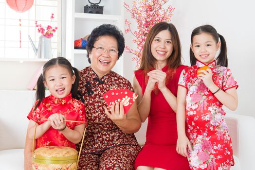 Multi generations Asian family celebrate Chinese new year at home.