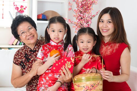 Beautiful multi generations Asian family celebrate Chinese new year at home.