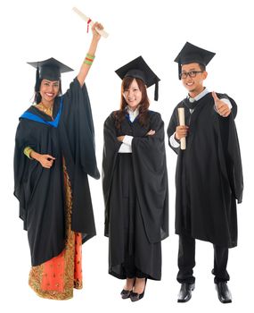 Full body group of multi races university student in graduation gown standing isolated on white background
