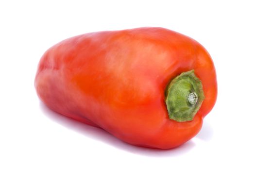Large red pepper. Photographed close-up on a white background.
