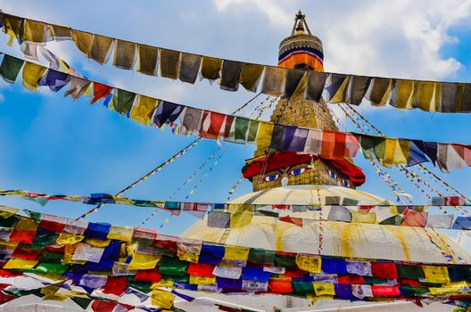 Bouddhanath stupa with colorful buddhist flags foreground, Kathmandu, Nepal