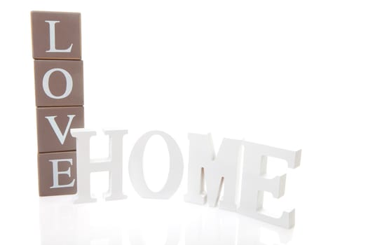 Word Love on blocks and Home in white letters isolated