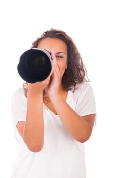 Pretty woman is a professional photographer with camera lens isolated