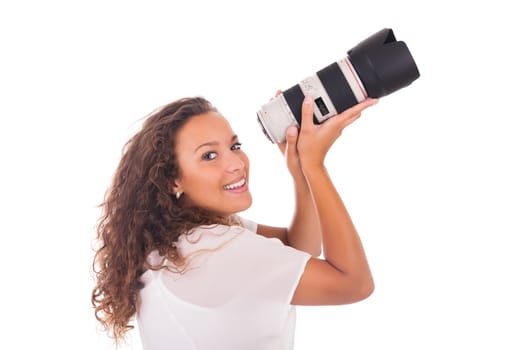 Pretty woman is a professional photographer with camera lens isolated