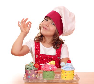 little girl cook with cupcakes and ok hand sign