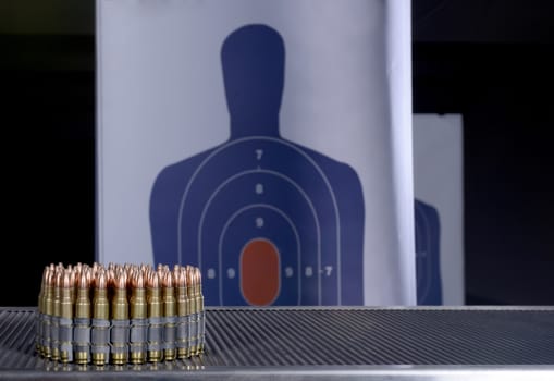 bullets and bullseye at gun range