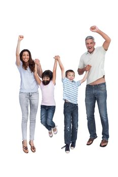 Cheerful family jumping against white background