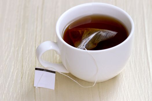 White cup of tea and tea bag