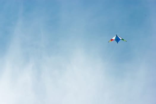 colorful kite flying in a nice blue sky