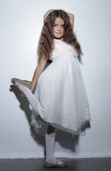 full-length portrait of a little girl in the studio