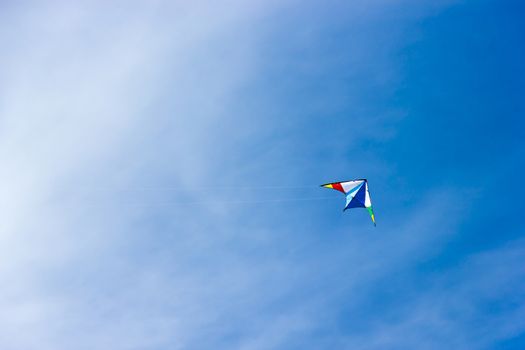 colorful kite soaring in a nice blue sky