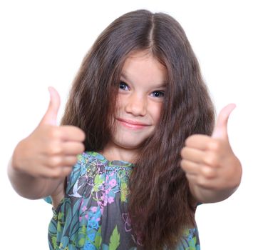 Beautiful little girl shows finger as sign that everything is fine