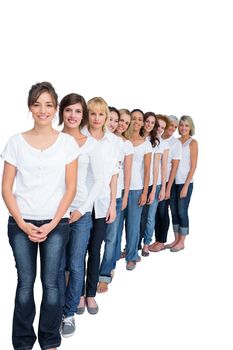 Cheerful casual models posing in a line on white background