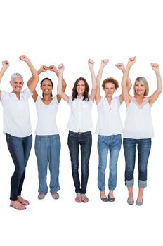 Cheerful casual models posing with hands up on white background