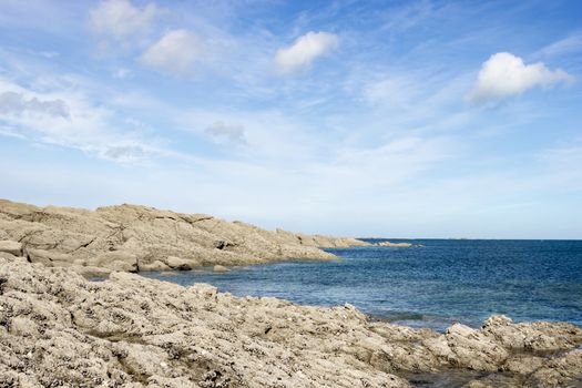 rocky coast of northern France against the beautiful blue sky