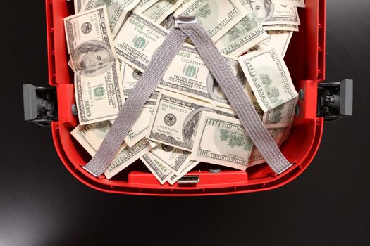 A Suitcase with lots of dollars
