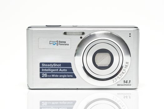 Digital compact camera on a white background