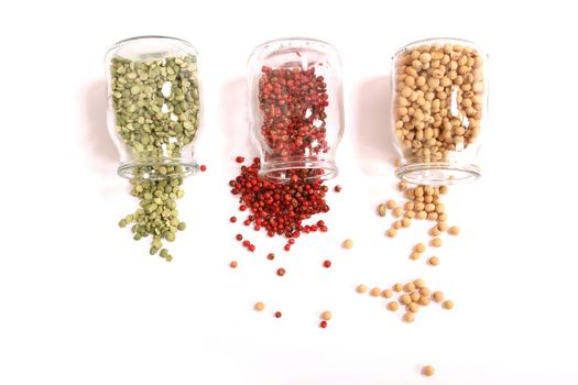 Variety of spices in a glass pot.
