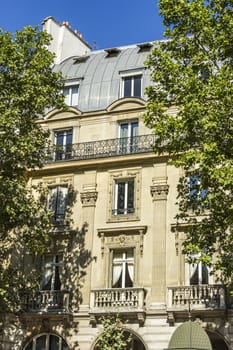 Facade of a traditional living building in Paris, France