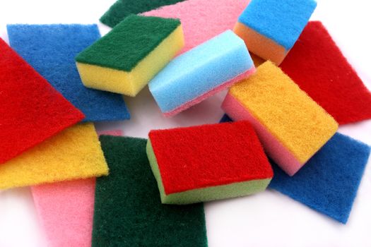 A lot of sponges in different colors background
