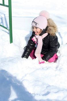 Beautiful little girl in winter park