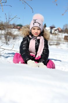 Beautiful little girl in winter park