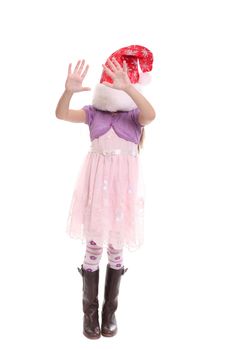 Portrait of happy little girl in Santa hat isolated on white background