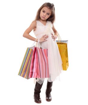 Beautiful little girl with shopping bags