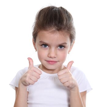 Beautiful little girl shows finger as sign that everything is fine