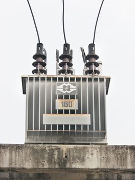 Transformer on a power pole in white background