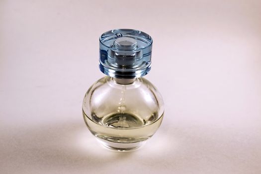 Photo perfume bottle on a pink background
