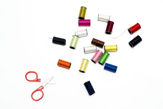 Sewing kit of scissors and coloured threads