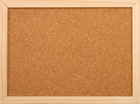 Cork board with a wooden frame.

