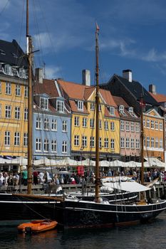 the skyline of the nyhavn, historical channel in the center of Copenhagen, Denmark, full of ancient multicolored houses