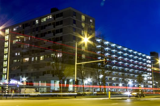 traffic through modern city at night in Amsterdam