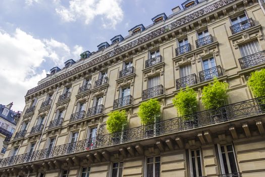 Facade of a traditional living building in Paris, France