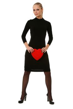 Portrait of a charming young girl on a white background holding a heart