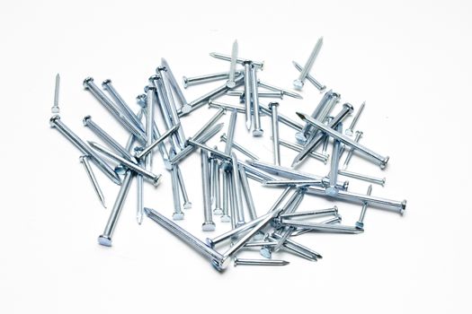 A pile of steel nails on white background