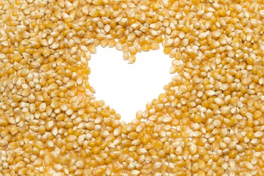 Popcorn seeds with heart shape on a white background