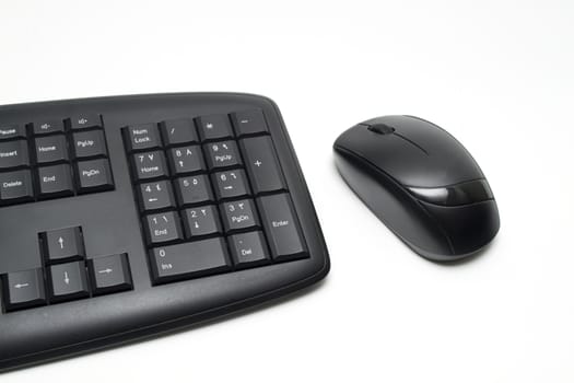 Black keyboard and mouse on a white background