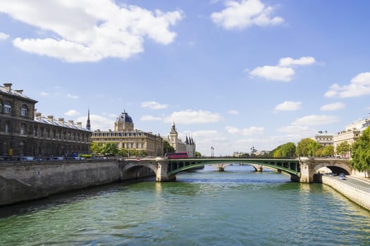 View of Palais de Justice and a bridge over the Seine river. Paris, France.