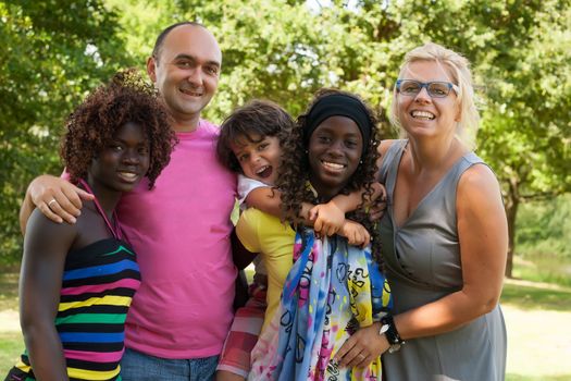 Happy multicultural family having a nice summer day