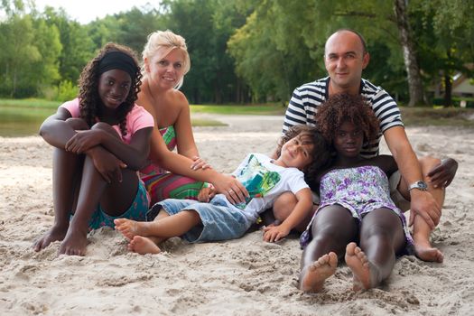 Happy multicultural family having a nice summer day