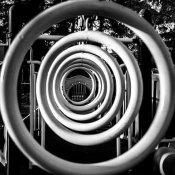 A row of monkey bar hanging rings at a children's playground