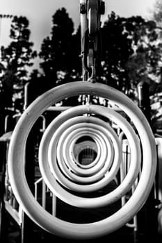 A row of monkey bar hanging rings at a children's playground